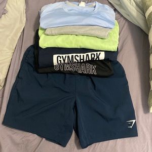 Gymshark lots 5 shirts and 1 short Med. and 1 vneck Gaiam